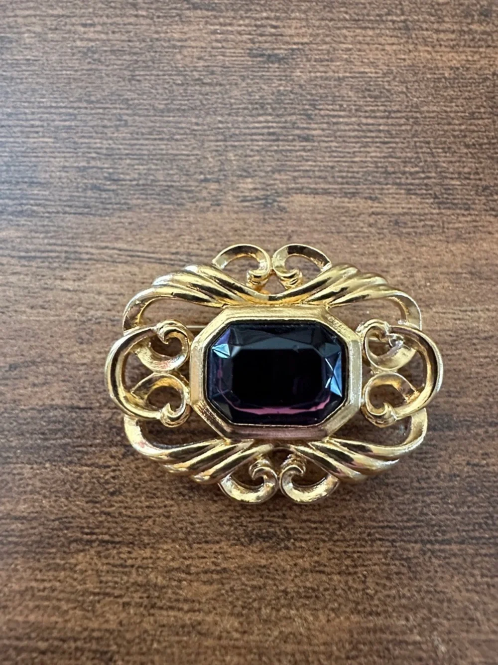 Gold-Tone Brooch with Deep Purple Center Stone